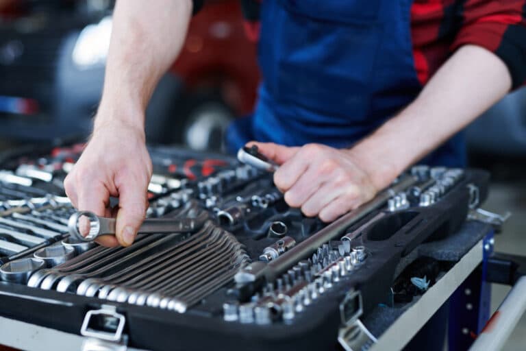 Man Organizing Toolbox