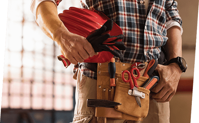 Man Carrying Lots of Tools in his Belt — Building Supplies in Heatherbrae, NSW