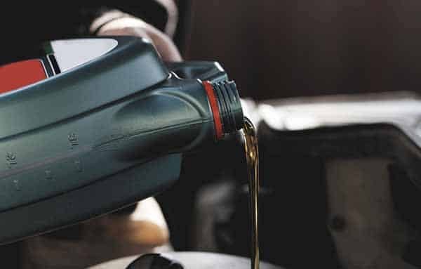 Oil Being Poured — Building Supplies in Heatherbrae, NSW