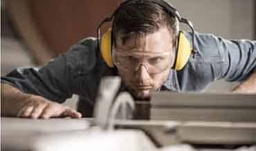 Man Spotting the Grinder — Building Supplies in Heatherbrae, NSW