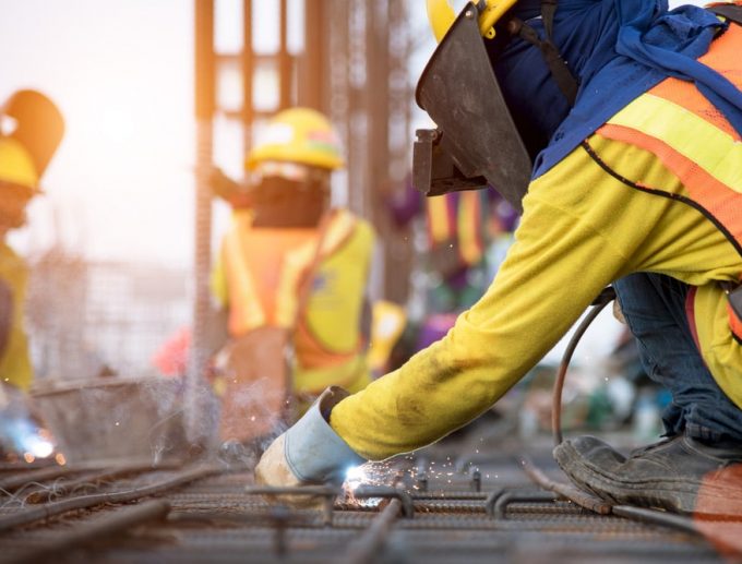Workers Wearing A Personal Protective Equipment
